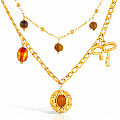 Collar de charms mixto con lazo Dorado y tonos brown (Stainless Steel)